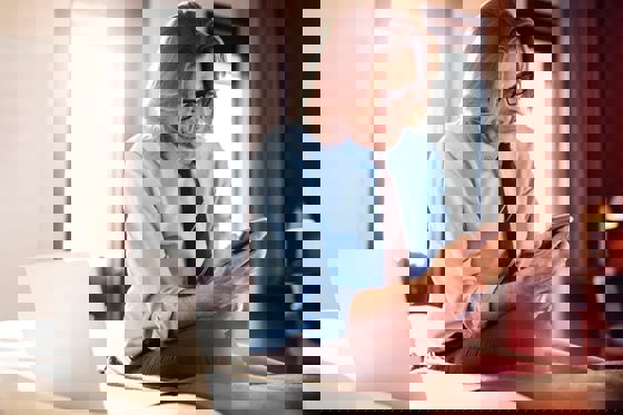 Man on his phone in a hotel room