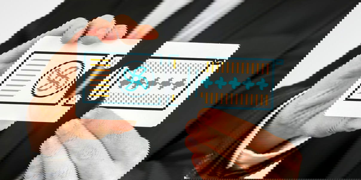 Businessperson holding two puzzle pieces symbolising the connection between heat pumps and radiators.